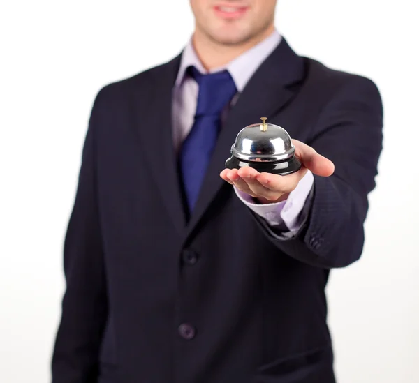 Waiter holding a hotel bell — Stock Photo, Image