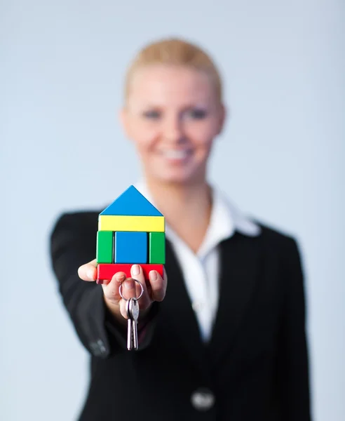Woman holding a house — Stock Photo, Image