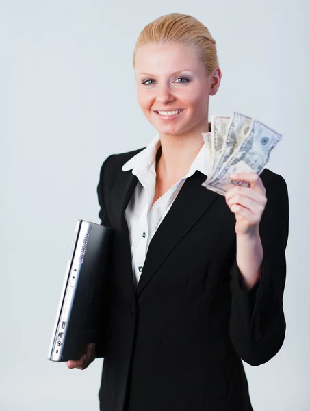 Žena držící dolary a laptop — Stock fotografie