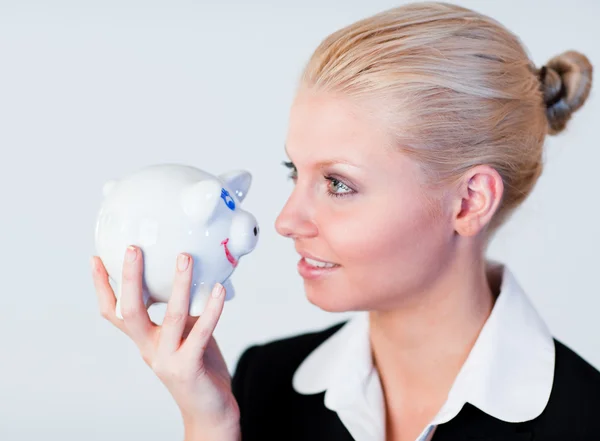 Smiling business woman holding a piggy Bank — Stock Photo, Image