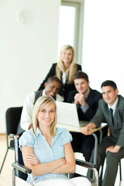 Businesswoman with her group working in the background — Stock Photo, Image