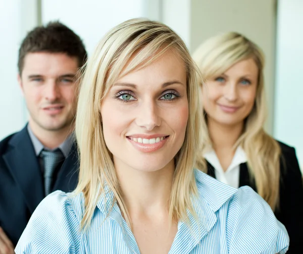 Portrait of a businesswoman in front of her team — Stock Photo, Image
