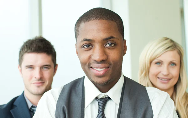 Portrait of an Afro-American businessman with his colleagues — Stock Photo, Image