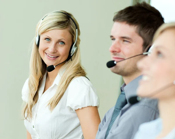 Businesspeople working with headsets — Stock Photo, Image