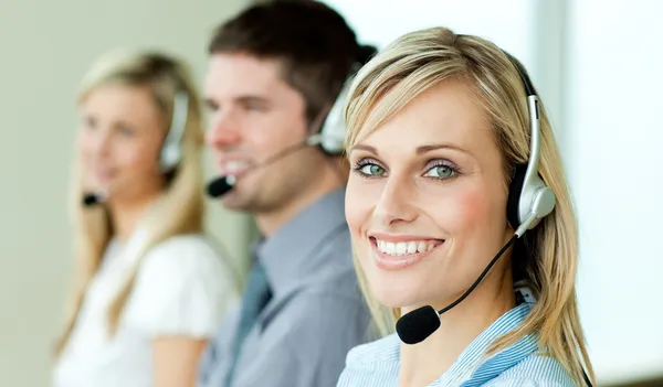 Young businesspeople working with headsets — Stock Photo, Image