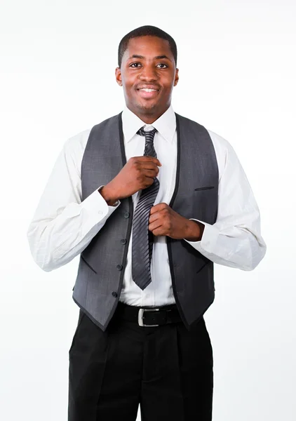 Young attractive businessman corrects a tie — Stock Photo, Image