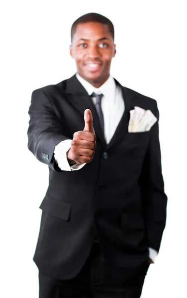 Glad affärsman med dollar i fickan visar tummen — Stockfoto