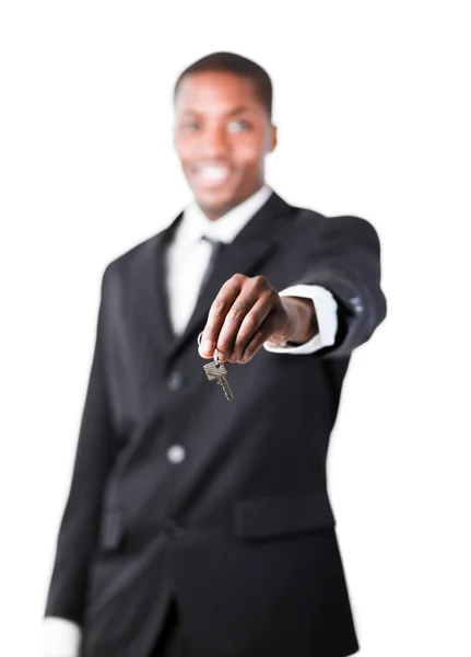 Young businessman holding a key — Stock Photo, Image