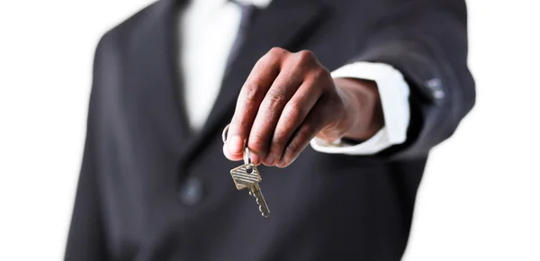 Detail podnikatel drží klíč — Stock fotografie