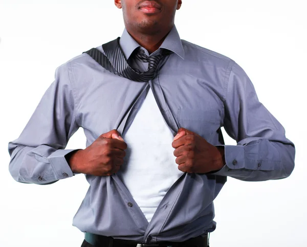 Businessman showing tshirt under his suit — Stock Photo, Image