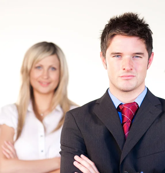Confident businessman in front of a businesswoman — Stock Photo, Image