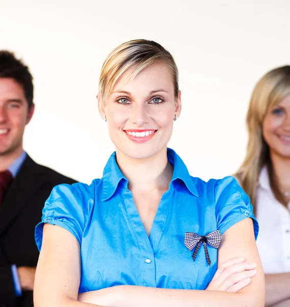 Beautiful businesswoman with her team in the background — Stock Photo, Image