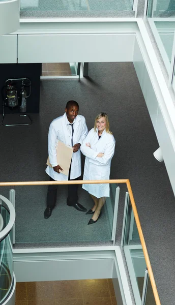 High view of male and female doctors smiling at the camera — Stock Photo, Image