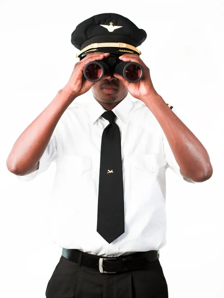 Piloto olhando através de binóculos — Fotografia de Stock