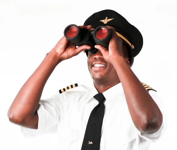 Piloot op zoek door middel van verrekijkers — Stockfoto