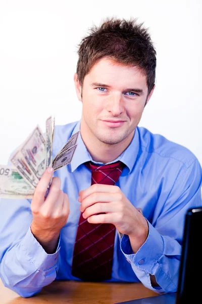Бизнесмен с деньгами в руках — стоковое фото