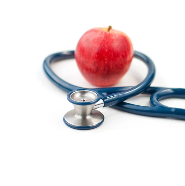 Stethoskop und ein Apfel — Stockfoto