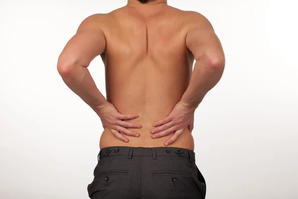 Человек с болями в спине изолирован agasint белый — стоковое фото
