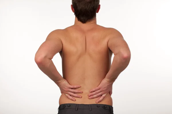 Homem com dor nas costas isolado agasint branco — Fotografia de Stock