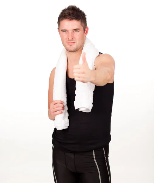 Sporting man with his thumbs up to the camera — Stock Photo, Image