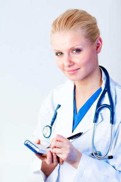 Female doctor writing a perscription — Stock Photo, Image