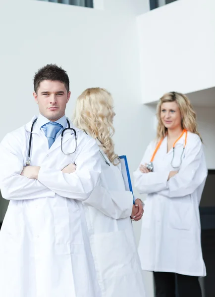 Three doctors in a hospital — Stock Photo, Image