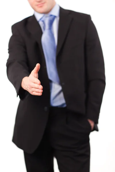 Businessman offering a handshake — Stockfoto