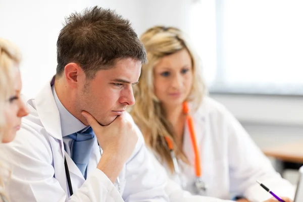 Team of doctors at a meeting — Stock Photo, Image