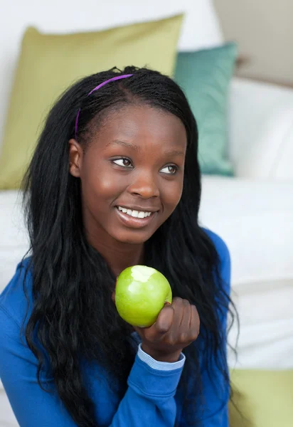 Cheerful woman eating an apple — Stock Photo, Image