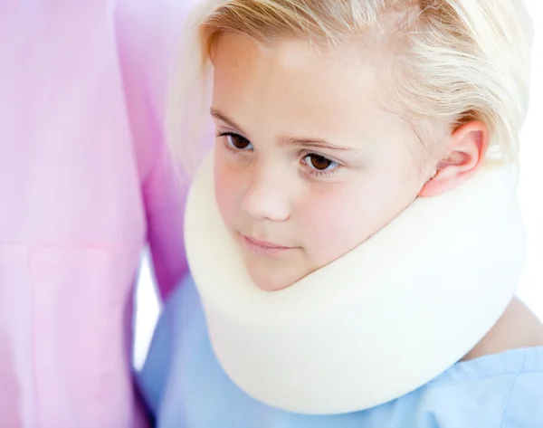 Close-up of a little girl with a neck brace — Stock Photo, Image