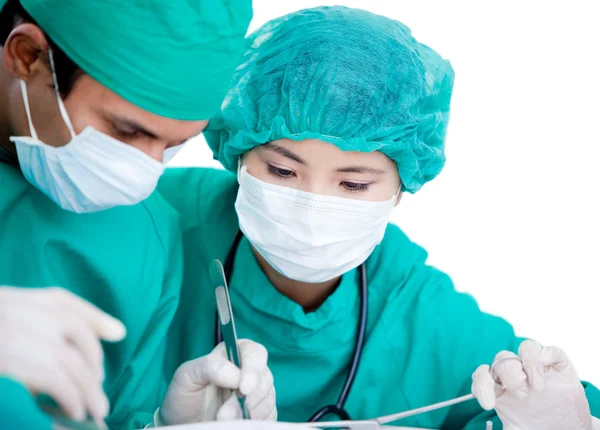 Medical partners making an operation using surgery equipment on — Stock Photo, Image
