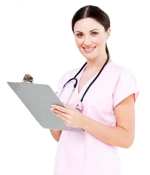 Uśmiechnięta kobieta lekarz pisze jej diagnoza — Zdjęcie stockowe