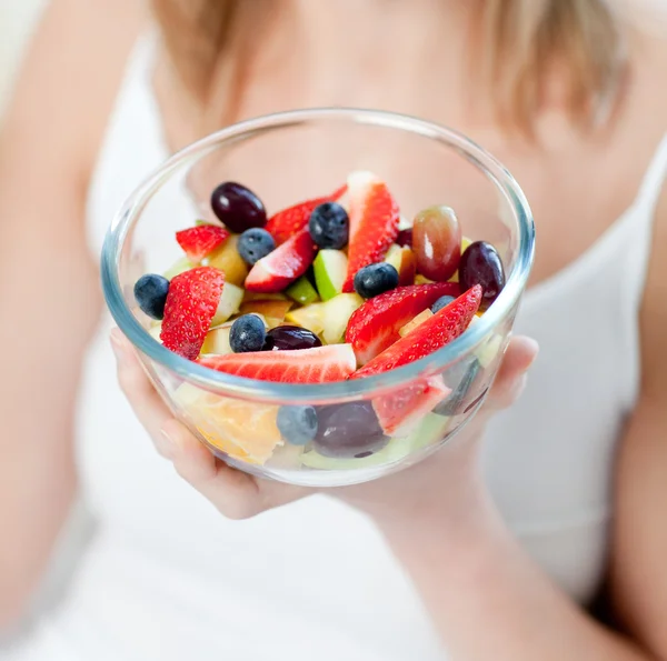 Close-up of a caucasian woman eating a fruit salad — Stock Photo, Image
