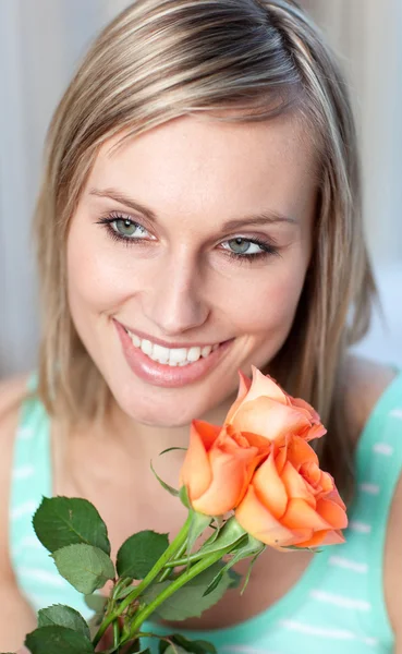 Portrait of a glowing woman holding roses — Stock Photo, Image