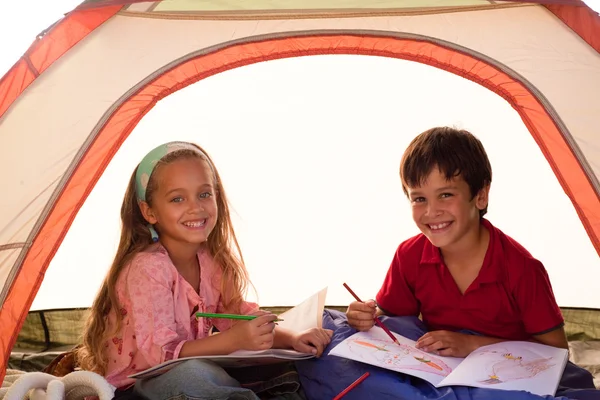 Kids drawing in a tent — Stock Photo, Image