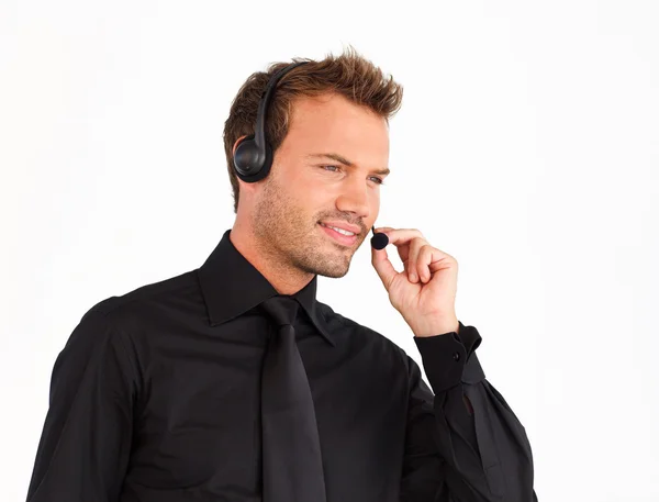 Podnikatel hovoří na sluchátka — Stock fotografie