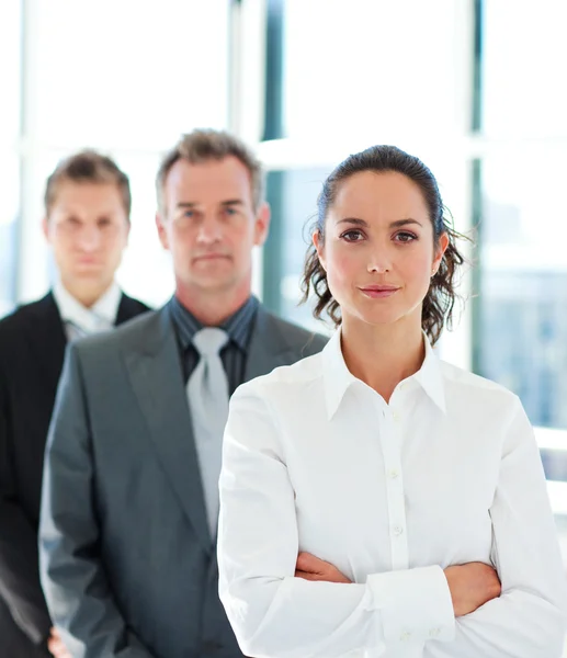 Businesswoman with folded arms in a line — Stock Photo, Image