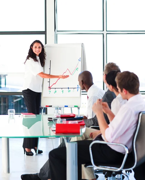 Confident businesswoman smiling in a presentation — Stock Photo, Image