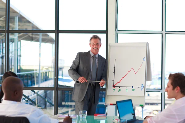 Mature businessman giving a presentation — Stock Photo, Image