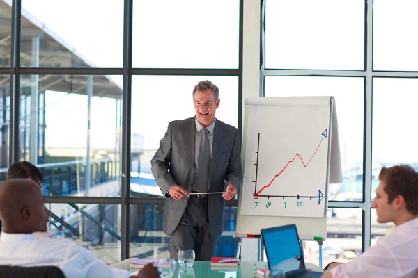 Senior businessman interacting to his colleagues — Stock Photo, Image