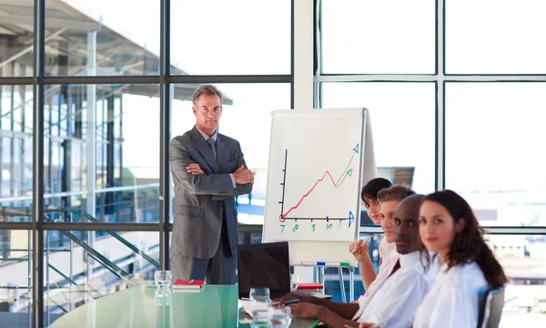 Confident mature manager giving a presentation — Stock Photo, Image
