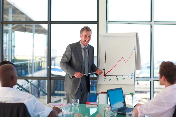 Mature manager speaking in a presentation — Stock Photo, Image