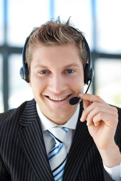 Businessman talking on a headset — Stock Photo, Image