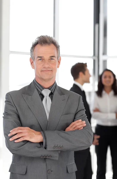 Senior Businessman with team in Background — Stock Photo, Image