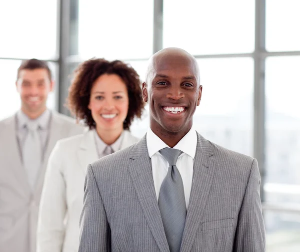 Smiling businessman with his team — Stock Photo, Image