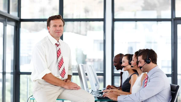 Mature manager in a call center — Stock Photo, Image