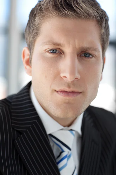 Young Attractive businessman looking at camera — Stock Photo, Image