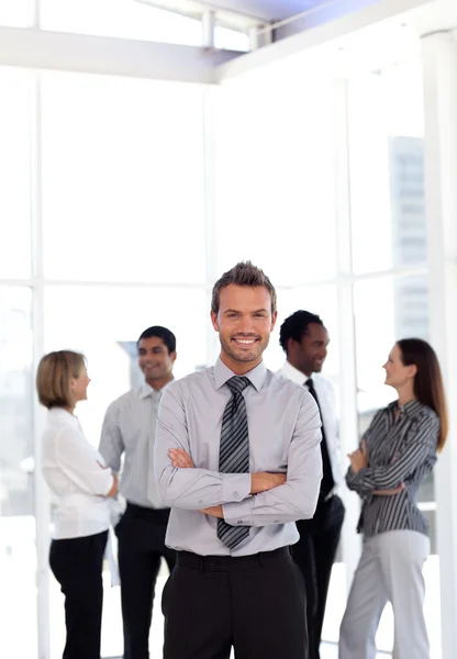 Portrait of a smiling male leader with his team — Stock Photo, Image
