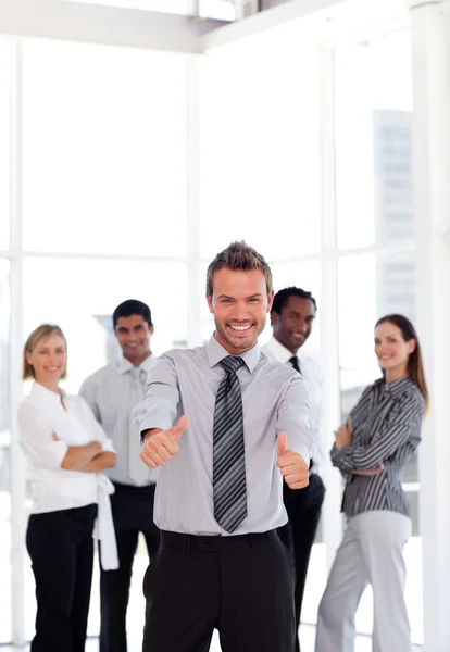 Portrait of a smiling male leader with his team — Stock Photo, Image