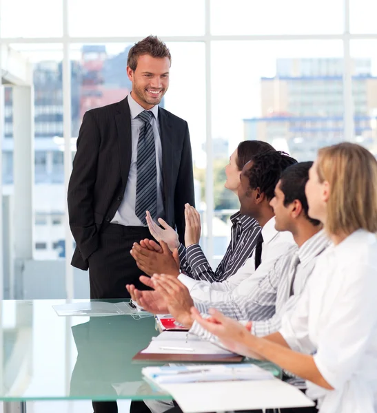 Business team applauding his colleague — Stock Photo, Image